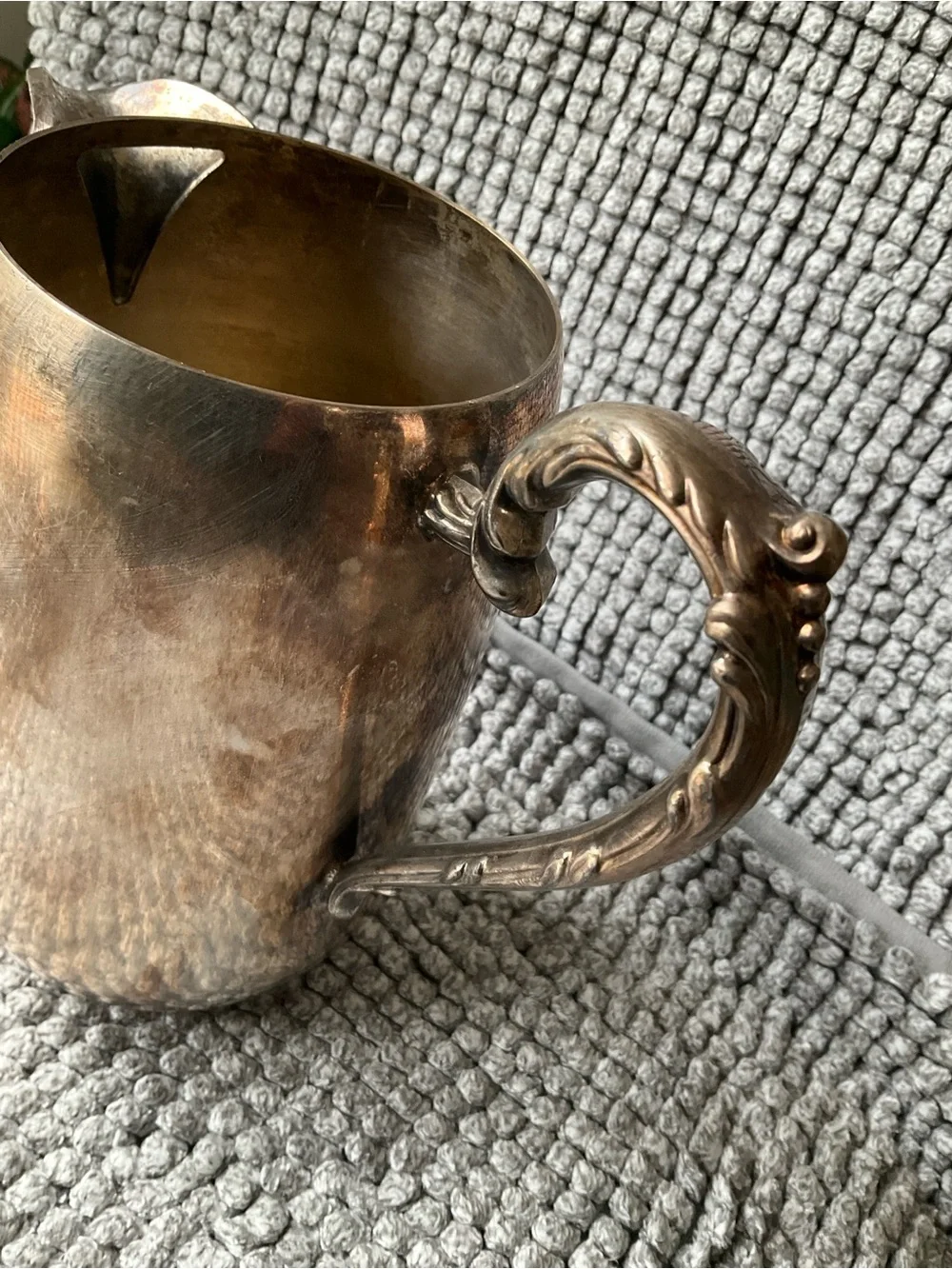 Polished Silver-Tone Decorative Metal Pitcher with Ornate Handle